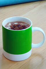 A cup of hot chocolate with tiny marshmallows