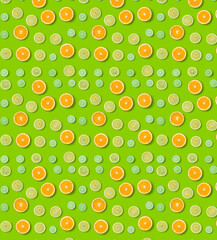 Citrus Fruits pattern on green background. Orange, Lime, Lemon slices background. Flat lay, top view.