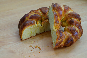 A braided challah brioche bread shaped as a heart cut in half