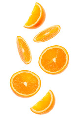 falling fresh orange fruit slices isolated on white background closeup. Flying food concept.