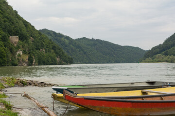 Obraz premium Three Wooden Boats Have Created Along The Danube River