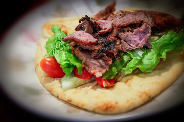 Greek healthy food gyros souvlaki wrap with roasted beef 