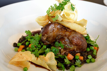 Tasty Knuckle Of Lamb With Beluga Lentils And Peas