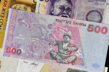 current money of kirguistan with selective focus