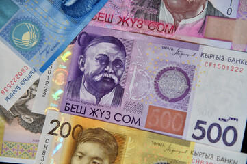 current money of kirguistan with selective focus