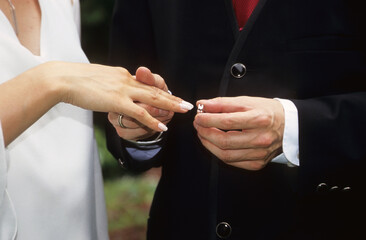 A Man Puts A Ring On The Finder Of His Wife