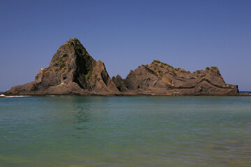 Fototapeta na wymiar Small Rocky Island On The Atlantic Coast In Mutriku Basque Country Atlantic Ocean Spain Europe