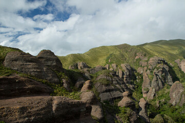Enchanting view of the forest growing on the rocky mountains and cliffs. 