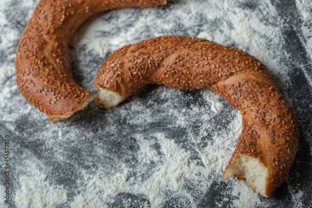 Wall mural Close up photo of Turkish simit on flour