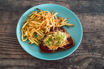 healthy plant-based food, vegan parma with plant-based schnitzel topped with tomato sauce and dairy-free cheese served with a side of chips