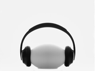 black earphones side view on oval shaped stand 