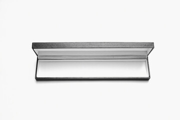 open box for jewelry in black leather, white inside, top view horizontal position 