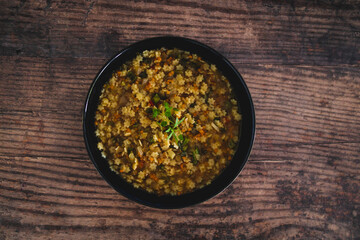 healthy plant-based food, vegan pasta in broth with lentils and vegetables