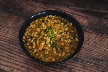 healthy plant-based food, vegan pasta in broth with lentils and vegetables