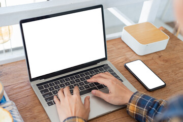 computer screen,cell phone blank mockup.hand woman work using laptop texting mobile.with white background for advertising,contact business search information on desk in cafe.marketing,design