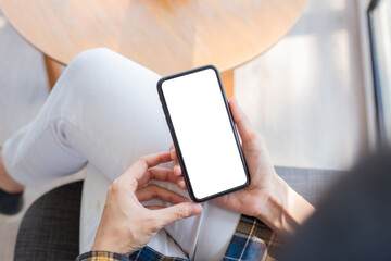 cell phone blank white screen mockup.woman hand holding texting using mobile on desk at office.background empty space for advertise.work people contact marketing business,technology