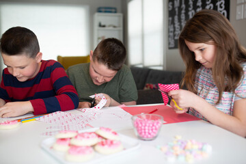kids writing valentine's day cards