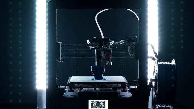 Timelapse of 3d Printer printing blue hand sculpture shot in 4k