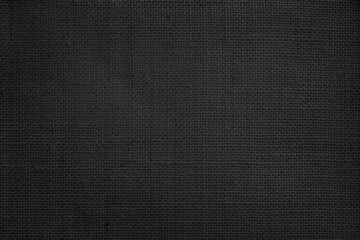Fototapeta na wymiar Jute hessian sackcloth canvas woven texture pattern background in light black color blank empty.