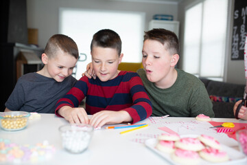 kids writing valentine's day cards