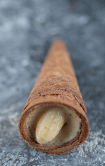 Sweet conus caramel candy on grey background