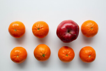 small oranges and one apple