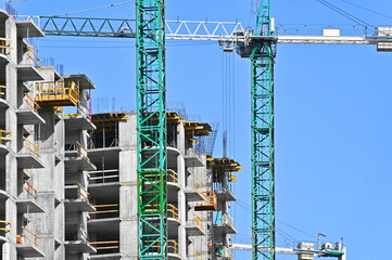 Crane and highrise construction site