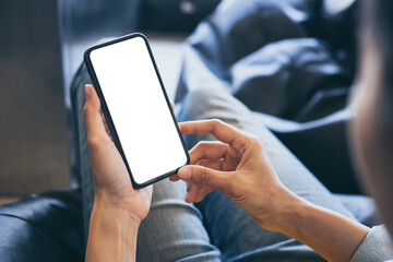 cell phone blank white screen mockup.woman hand holding texting using mobile on desk at office.background empty space for advertise.work people contact marketing business,technology