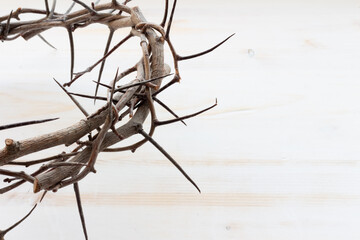 crown of thorns on white wood