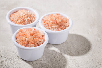 pink himalayan salt, in bowl on white background