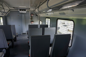 Obraz premium police car paddy wagon inside, national guard, gray car body, bars on windows