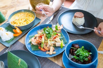 eating many Thai food recipe at restaurant
