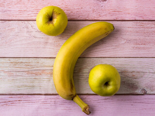 Photo for an article on mortgages and banks. Banana and apple in the form of a percent sign.