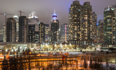 A night cityscape of landmarks and the busy downtown centre of Calgary Alberta Canada.