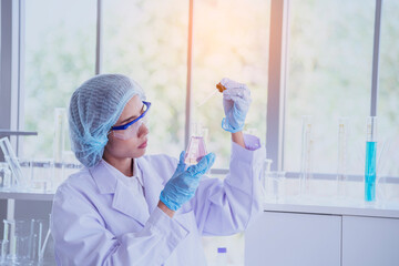 Female scientist look at microscope, science test tube analyse scientific sample in laboratory research experiment biotech make cultivate vaccine against virus. Chemistry science laboratory concept