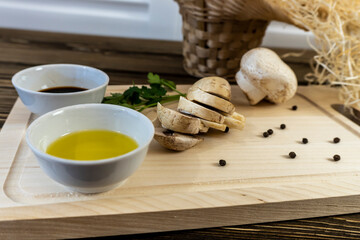 Still life, Food photo of mushrooms champignons. Mushrooms whole and chopped, basket with mushrooms