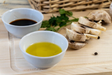Still life, Food photo of mushrooms champignons. Mushrooms whole and chopped, basket with mushrooms