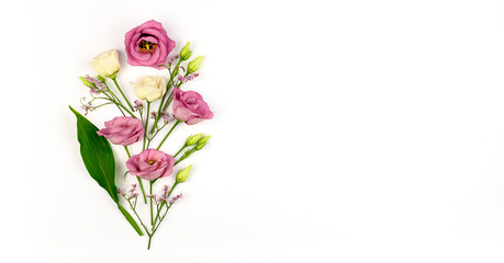 Spring composition. Flowers, paper blank white background. Flat lay, top view, copy space, mock up.