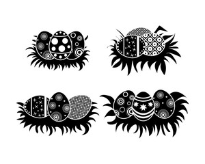 Black silhouettes of vector easter eggs. set of black and white eggs lying horizontally decorated with ornaments on a white background. Vector