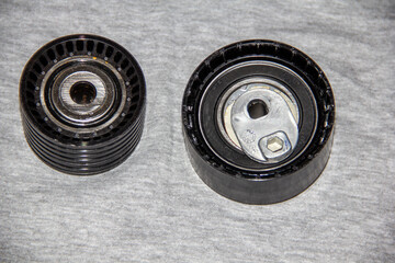 Automotive Parts - New Engine Attachment Belt Rollers. New drive belt rollers for car engine accessories.