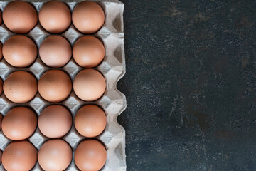Raw chicken eggs organic food for good health high protein on rustic dark background