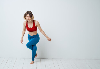 woman in blue leggings gymnastics sport fitness yoga asana