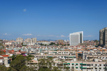 Fototapeta na wymiar Xiamen city skyline with modern office buildings and residential district against blue sky
