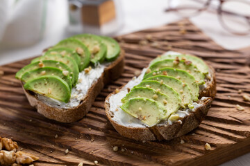 sliced avocado on toast bread with nuts