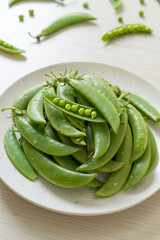 fresh sweet green peas on plate