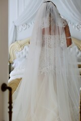 wedding photo where is the bride in white dresses against the background of the bedroom