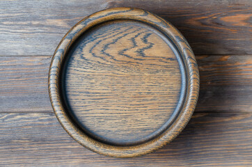 Brown wooden background made of design boards. Wooden plate for eating