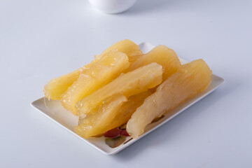 Cassava and coconut milk on white background
