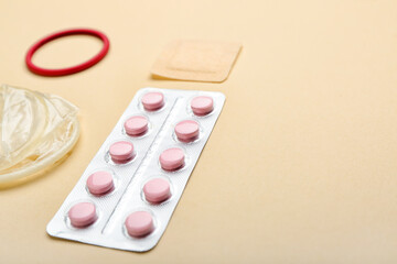 Different contraceptives on color background