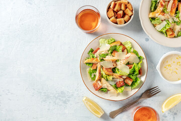 Chicken Caesar salad, shot from the top with copy space